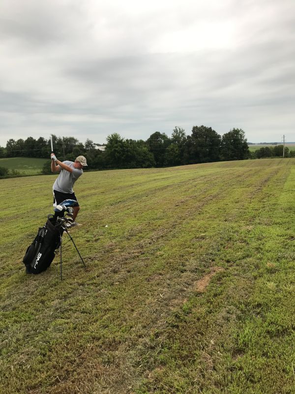 Charlie Golfing in Our Backyard