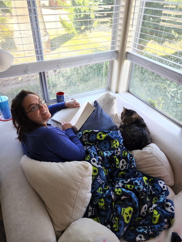 Sarah Reading With Our Cats
