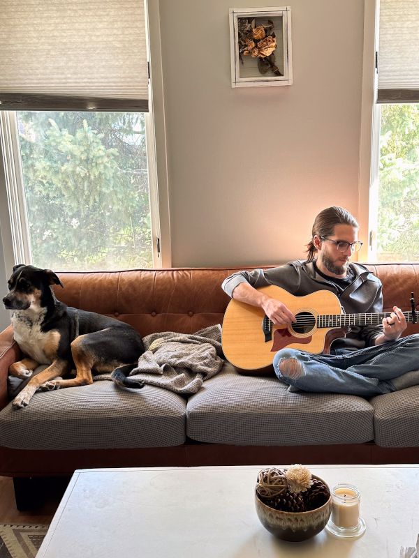 Grey Playing Guitar