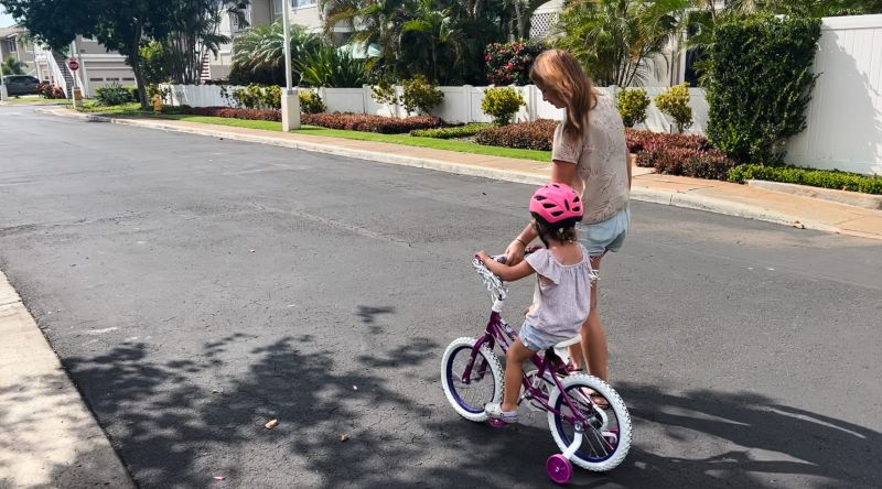 Abby Helping Her Niece Ride A Bike