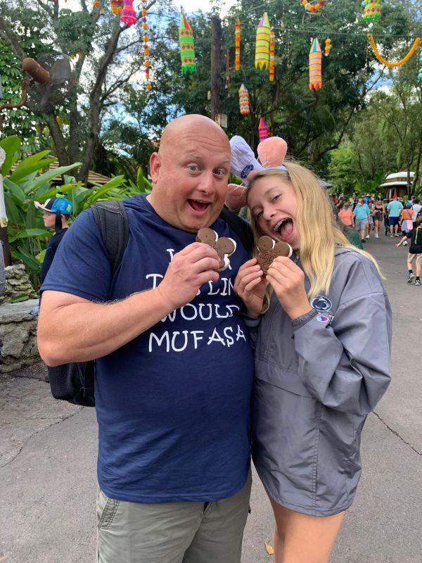 Mike & Our Niece Enjoying Mickey Ice Cream