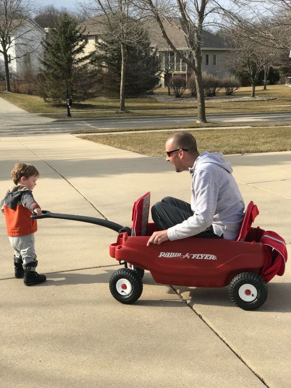 Rowan Taking Justin for a Ride in His Wagon